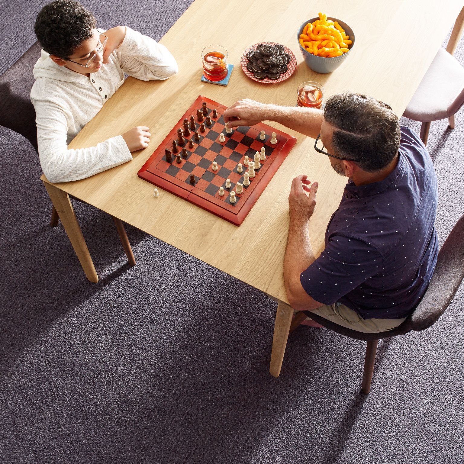 Two people playing chess - Coastal Floor Covering Inc in Crowley