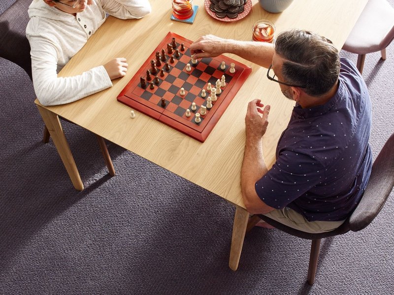 Two people playing chess - Coastal Floor Covering Inc in Crowley, LA